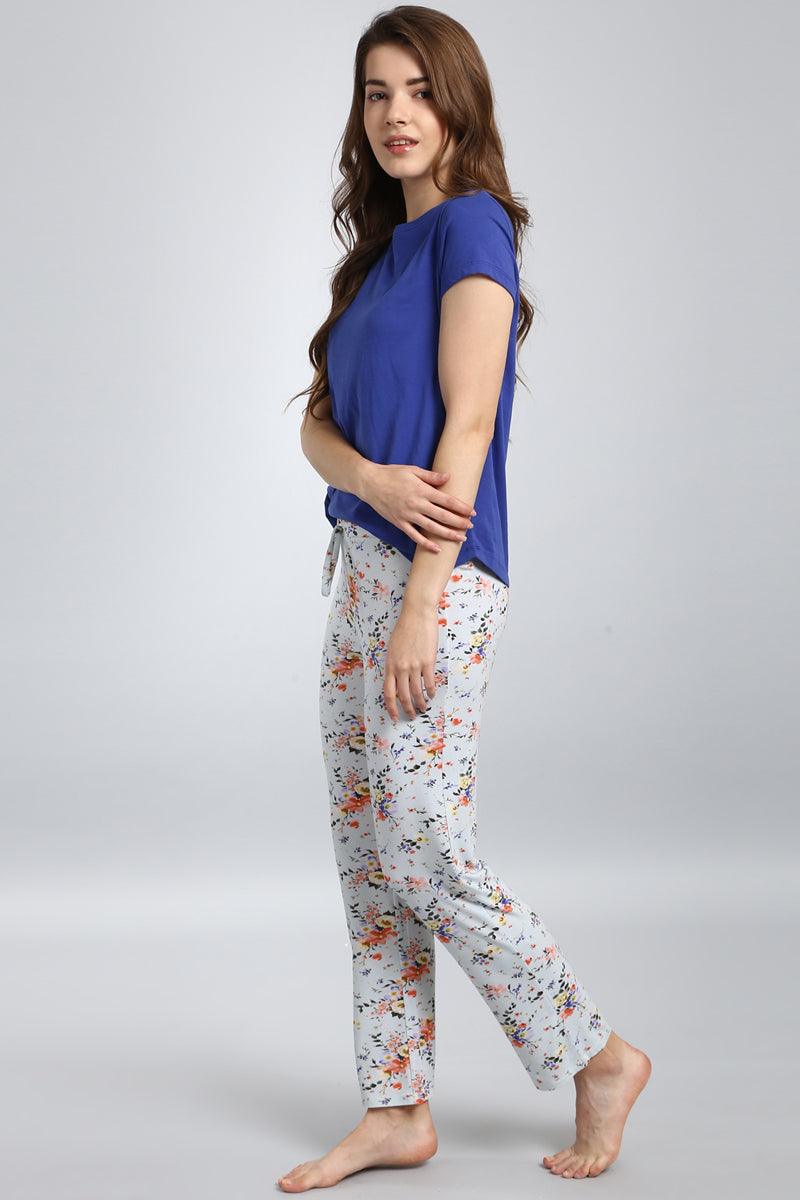 Delicate floral pajama set featuring a blue top and patterned pants.