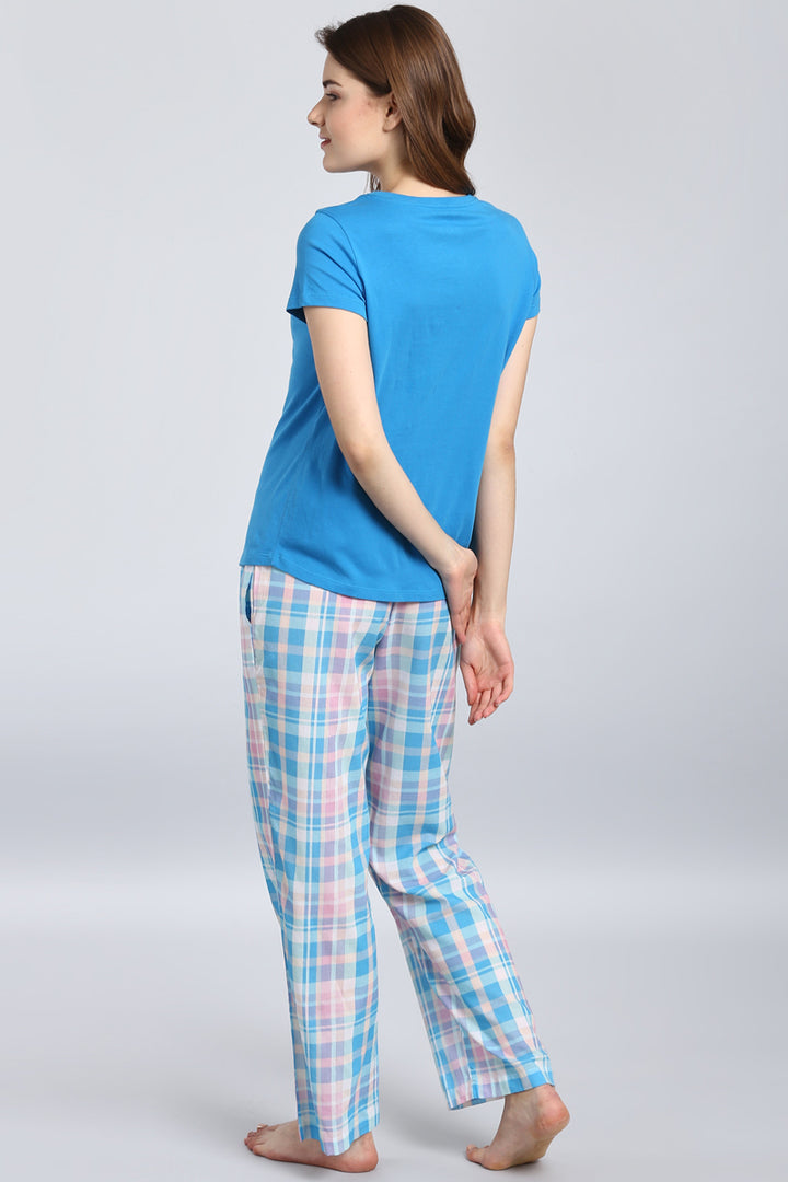 Soothing blue top paired with comfortable plaid pants for loungewear.