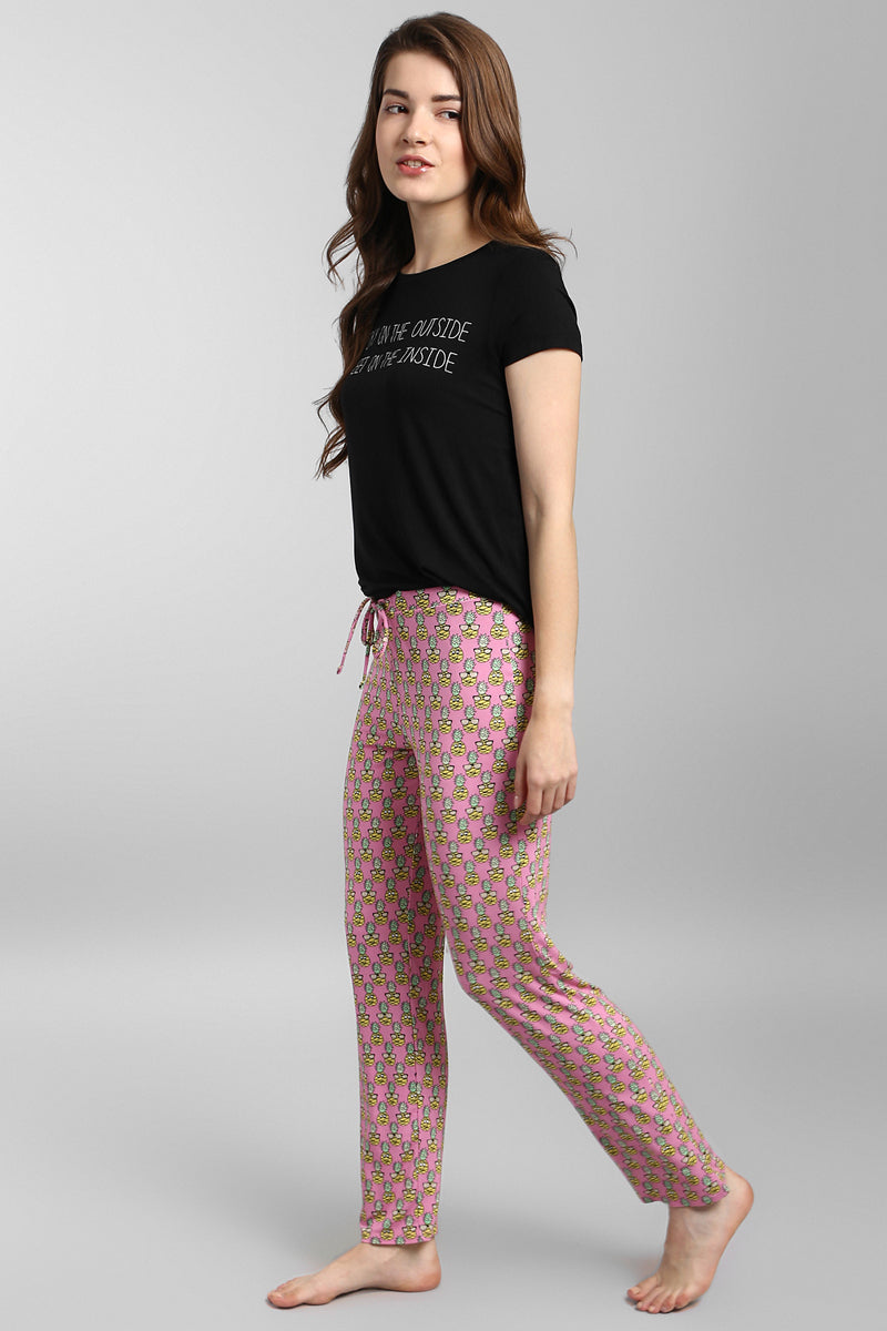 Tropical Vacay Pajama Set featuring a stylish black tee and patterned pants.