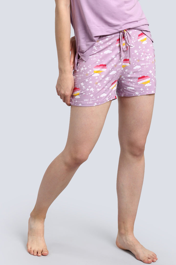 Day Dream Sparkle Shorts featuring vibrant cupcake print on lilac background.