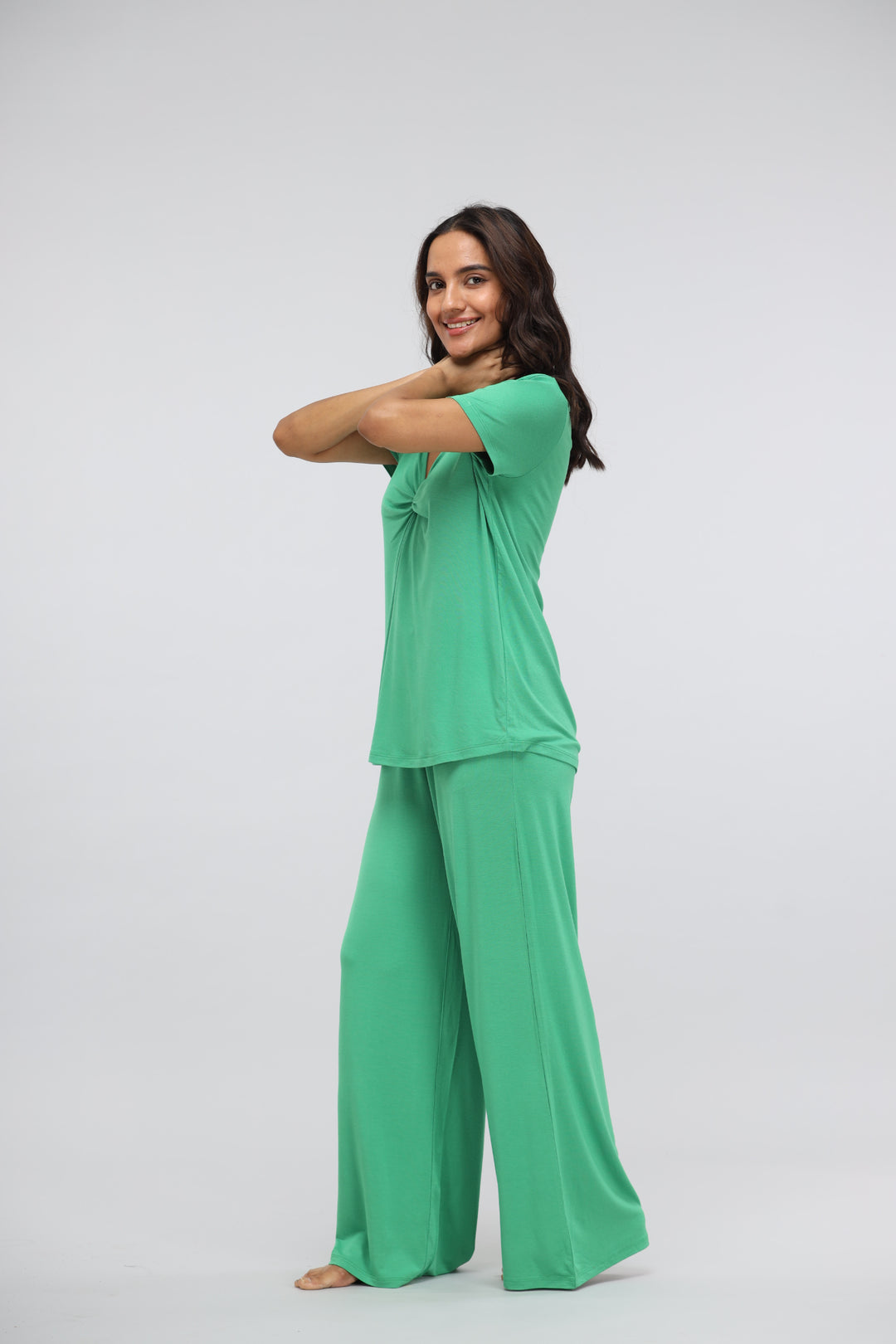 Green Bee Flared Modal Lounge Set with Knot Top model wearing outfit.