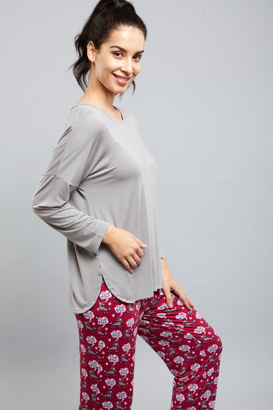 Model wearing a stylish Dreamy Grey Top with casual pants.