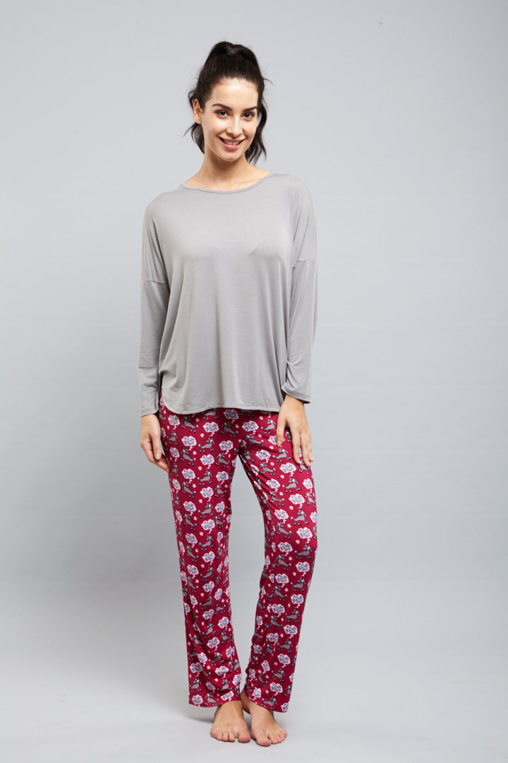 Dreamy Grey Top paired with floral pajama pants, model smiling.