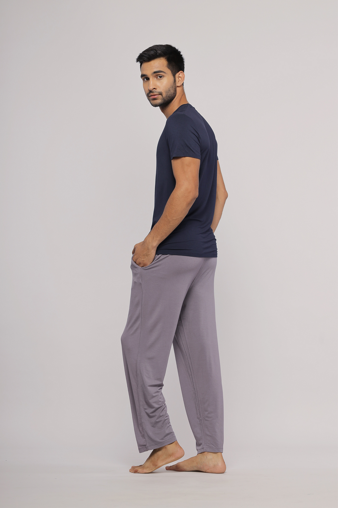 Man wearing Wanderer Grey Men's Pajama Set, showcasing comfort and style.