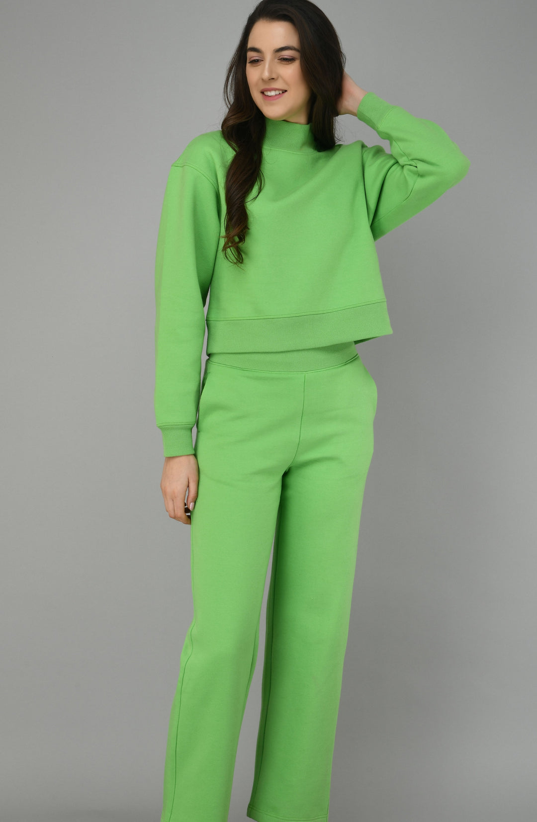 Glam Green Fleece Lounge Set model displaying comfortable matching apparel.