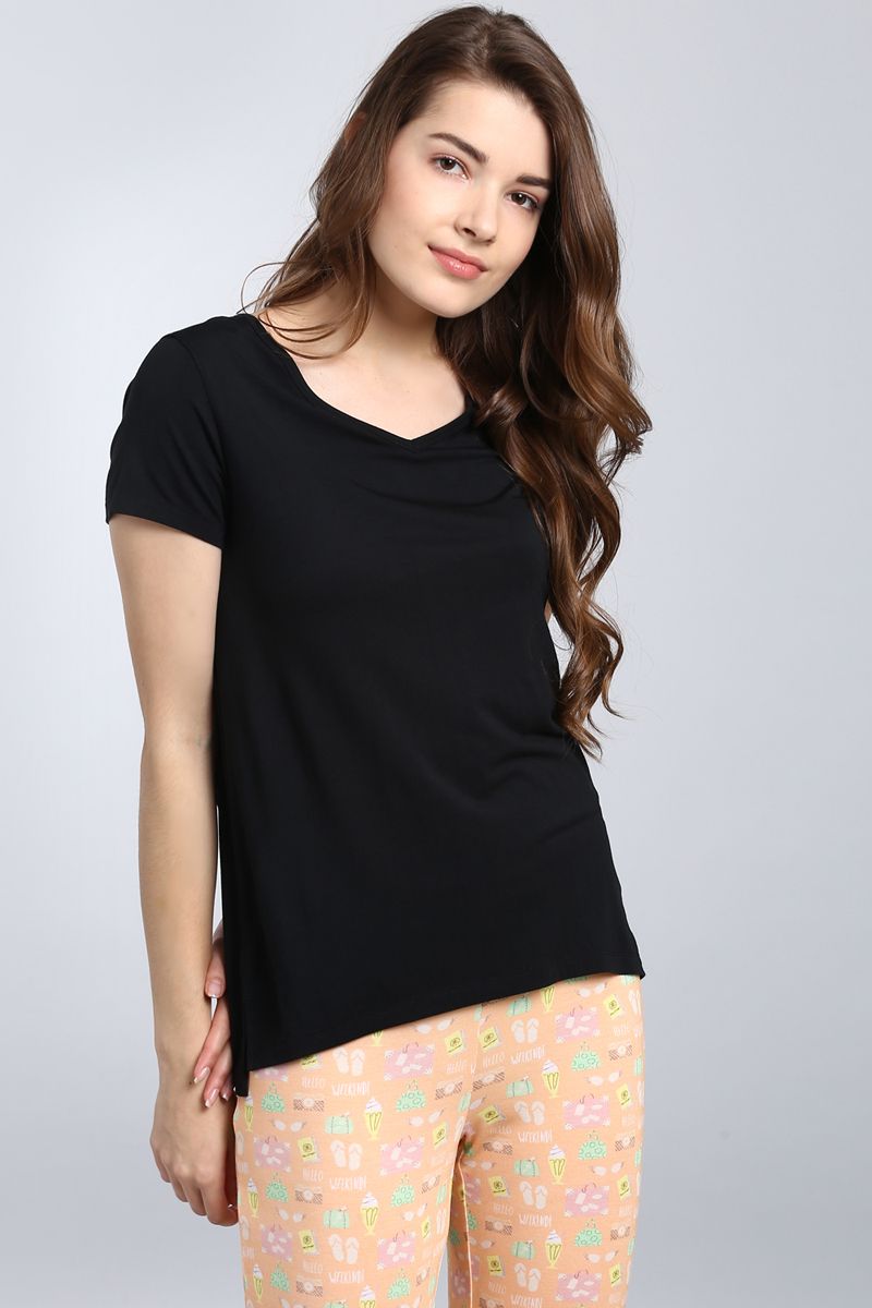 Dreamy Weekend Pajama Set featuring a stylish black top and playful patterned pants.