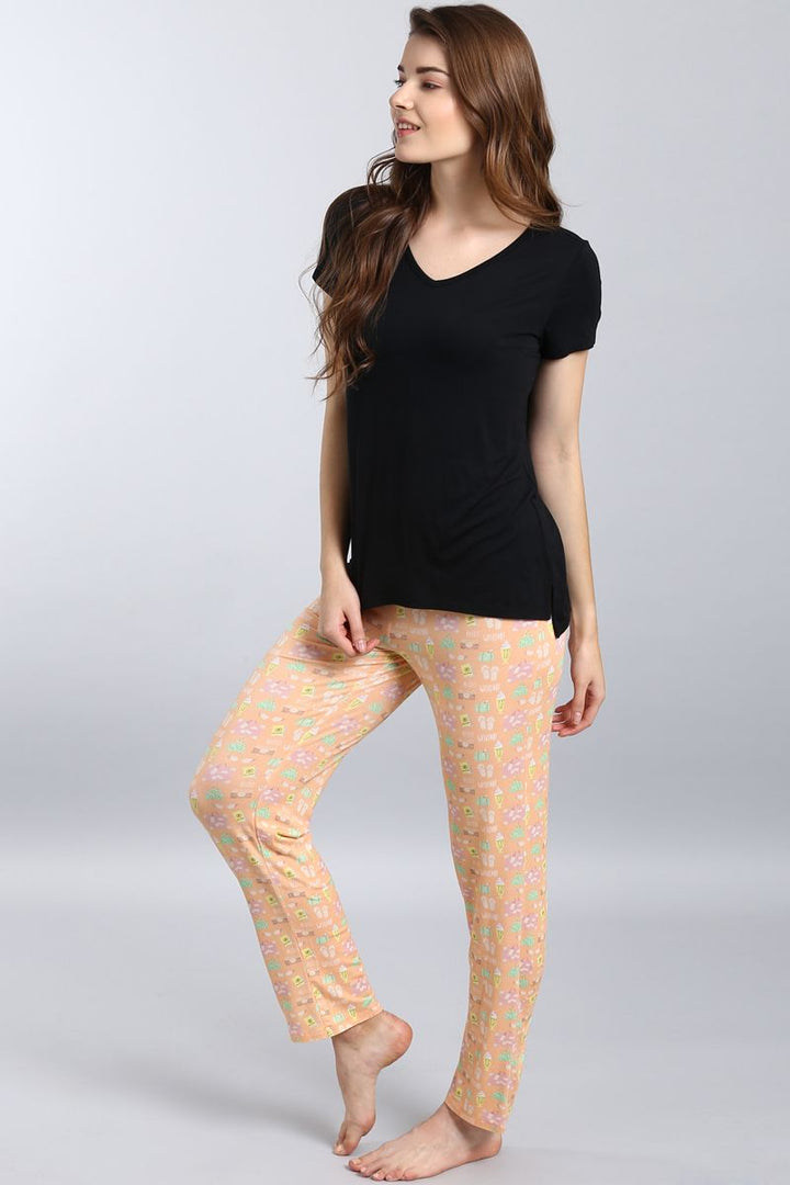 Dreamy Weekend Pajama Set featuring comfy black top and patterned pants.